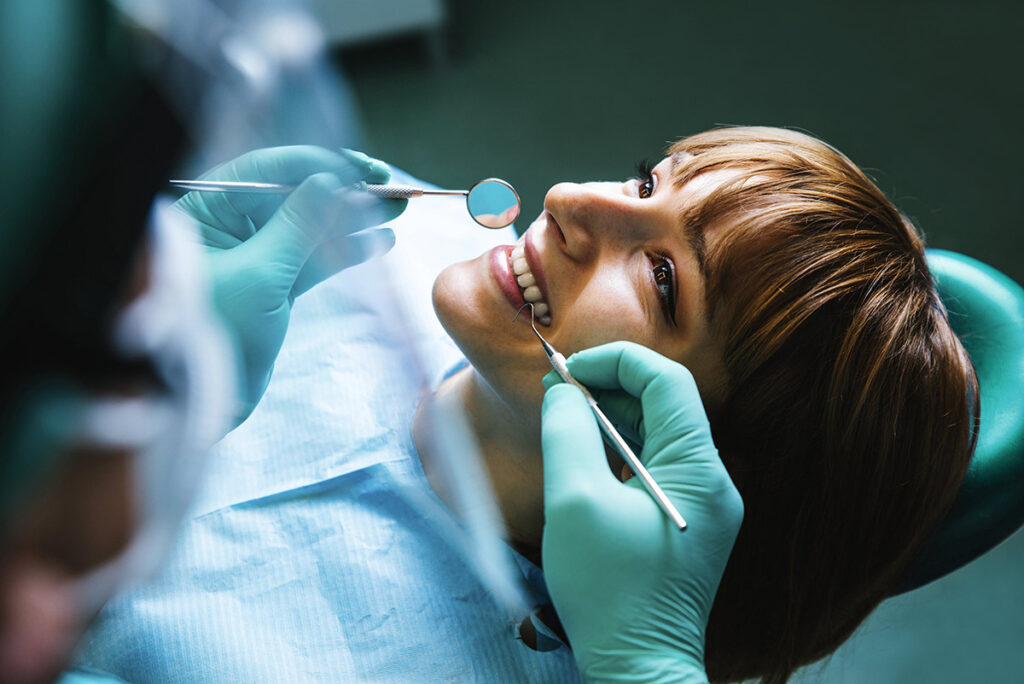 dentist working on patient's teeth - how covid-19 has shaped the dental industry