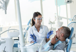 Dentist working on a patient with sensitive gag reflex